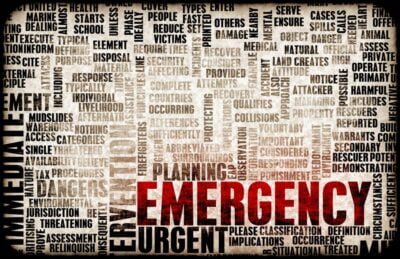 This is a word cloud design focused on the theme of "Emergency." It features a variety of words and terms associated with urgent situations, prominently highlighting the words "EMERGENCY" and "URGENT" in bold red letters. Other words, such as "planning," "response," "medical," "assess," "danger," and "immediate," are arranged in varying sizes and orientations, creating a textured visual related to emergency preparedness and response. The background has a distressed, textured look that contributes to the overall urgent and serious tone of the image.